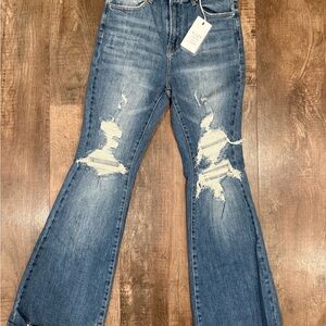 Stylish Blue Flare Jeans with Distressed Details